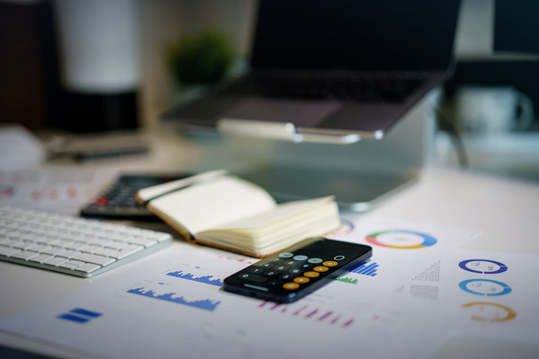 Financial planning workspace with charts and calculator for website pricing article